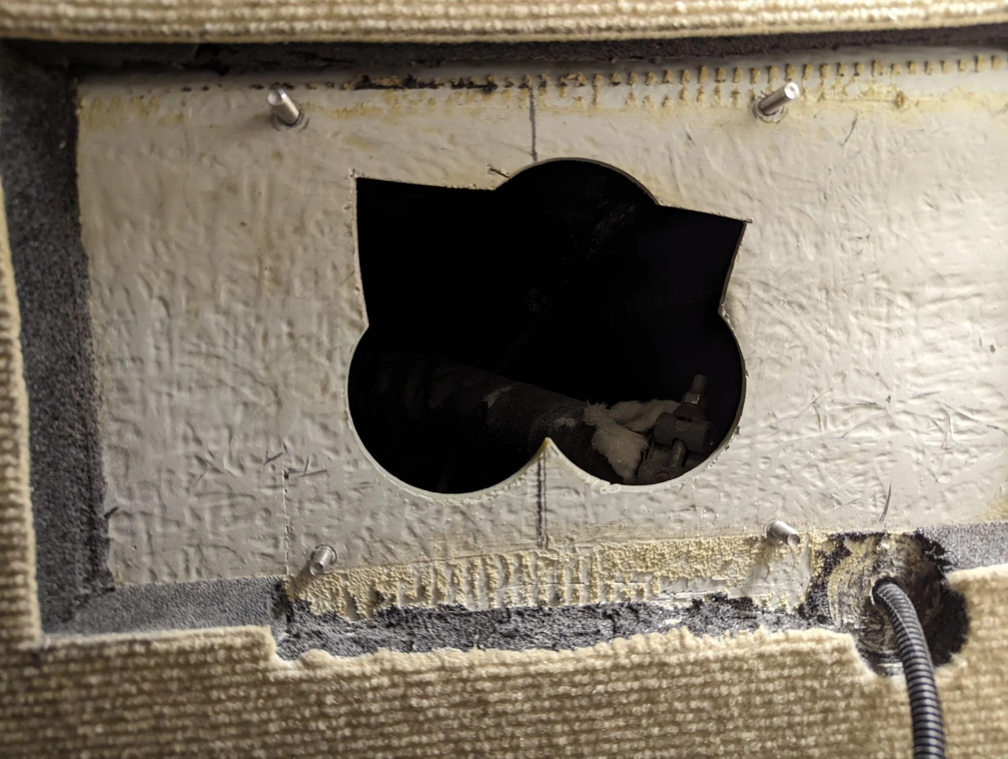 The sexy pig-batman-ass hole in which we fit the heater.