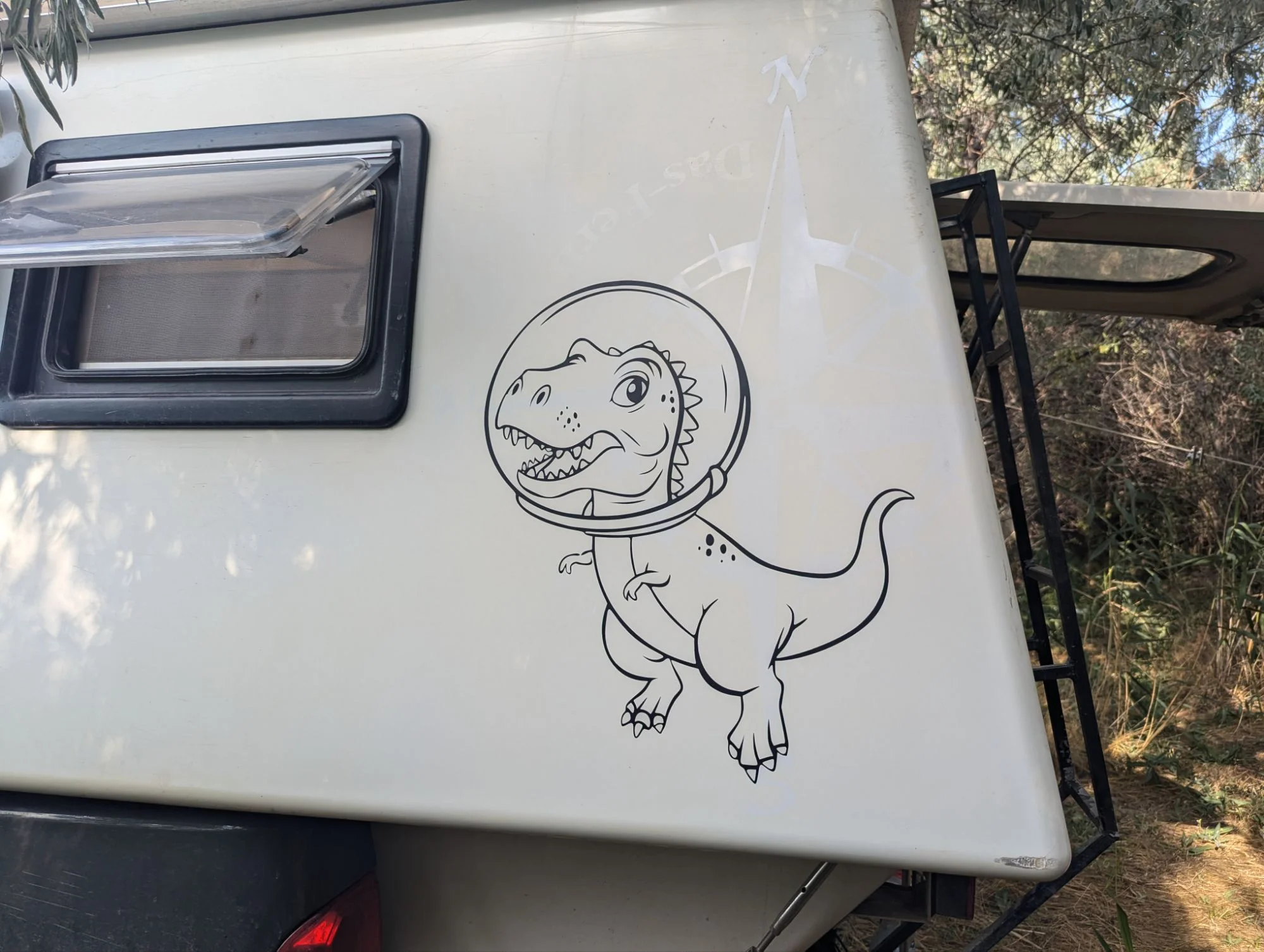 In Almaty we had stickers for Rosinante printed. A dino for me.