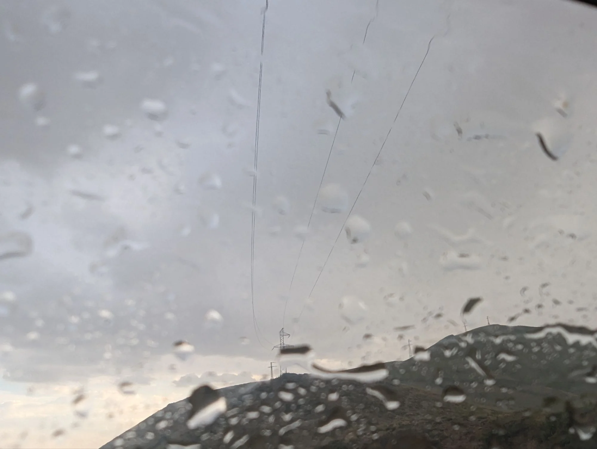 One day we parked in the line of a crazy thunderstorm. Maybe it was the most powerful one I&rsquo;ve ever witnessed. We had to very quickly close Rosinante&rsquo;s roof and the whole car was shaking like crazy. In the photo you see the big power lines pushed by the storm in a horizontal position.