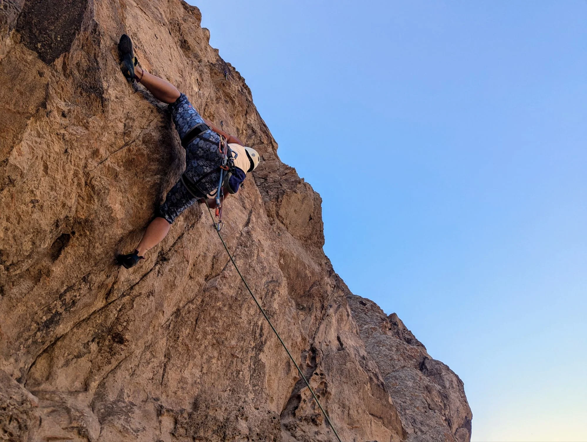 Climbing on an overhanging wall.