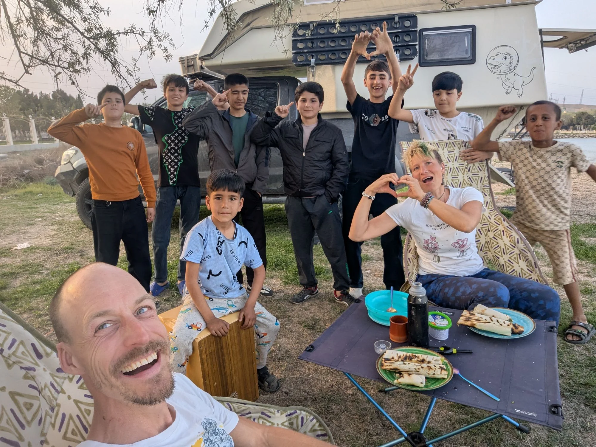 We entered Tajikistan for the second time after we did the Pamir Highway in summer 2024 and found a camp spot at a lake in the first bigger town after the border to Uzbekistan. Soon three kids joint us. Because of the language barrier, we exchanged only some basic communication. We played on my cajon and soon some more children joint us. So we had a whole gang around us. But it was fun. After the children a younger couple came around and after them came the police. The police officers were interested in Rosinante and our nomad life and the leader of the group could speak some German and gave us his phone number to call him if we need help or something else. So for us meeting the police was fun. For the younger couple who came along before it was not so much fun because they had to pay a fine for &ldquo;romantic behavior in public&rdquo;. Different cultures, different rules&mldr;