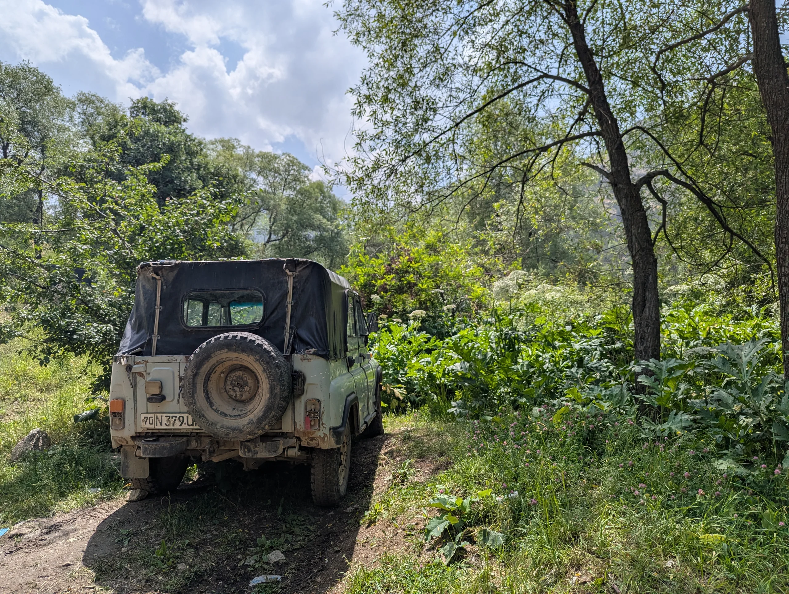 This is one of the offroad taxis. Most of them are old Russian jeeps. If these are the only cars you encounter and there are no ordinary limousines on a road or track, you know that the track will get serious.
