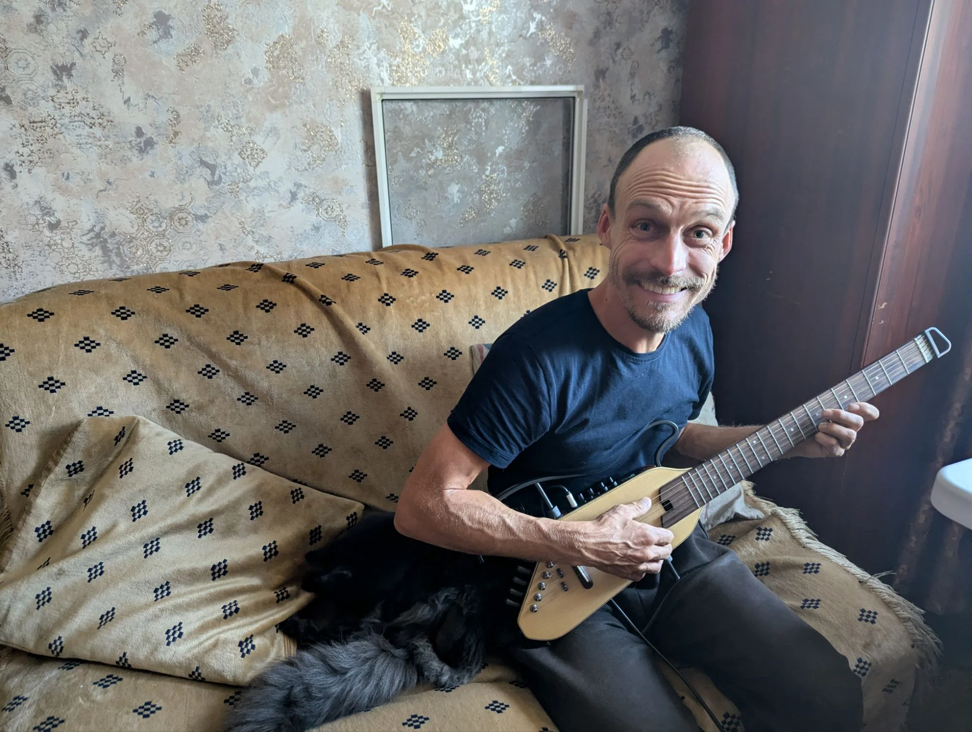 I practiced playing guitar and we liked our apartment life with our two pet friends 🎸