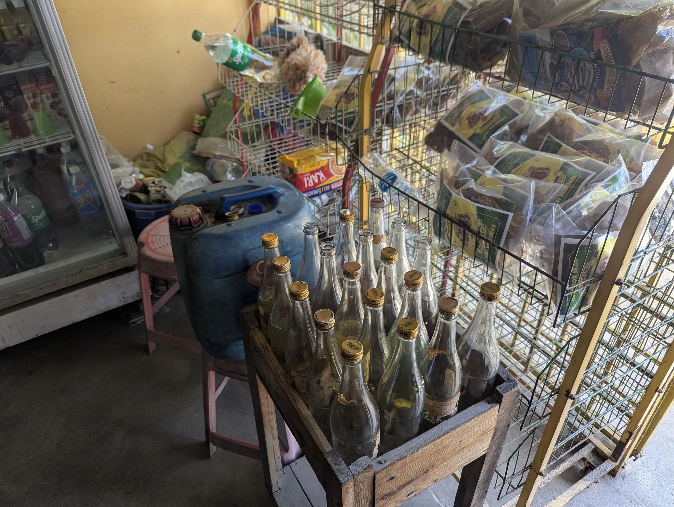 Scooter benzene in glass bottles at the mini market.