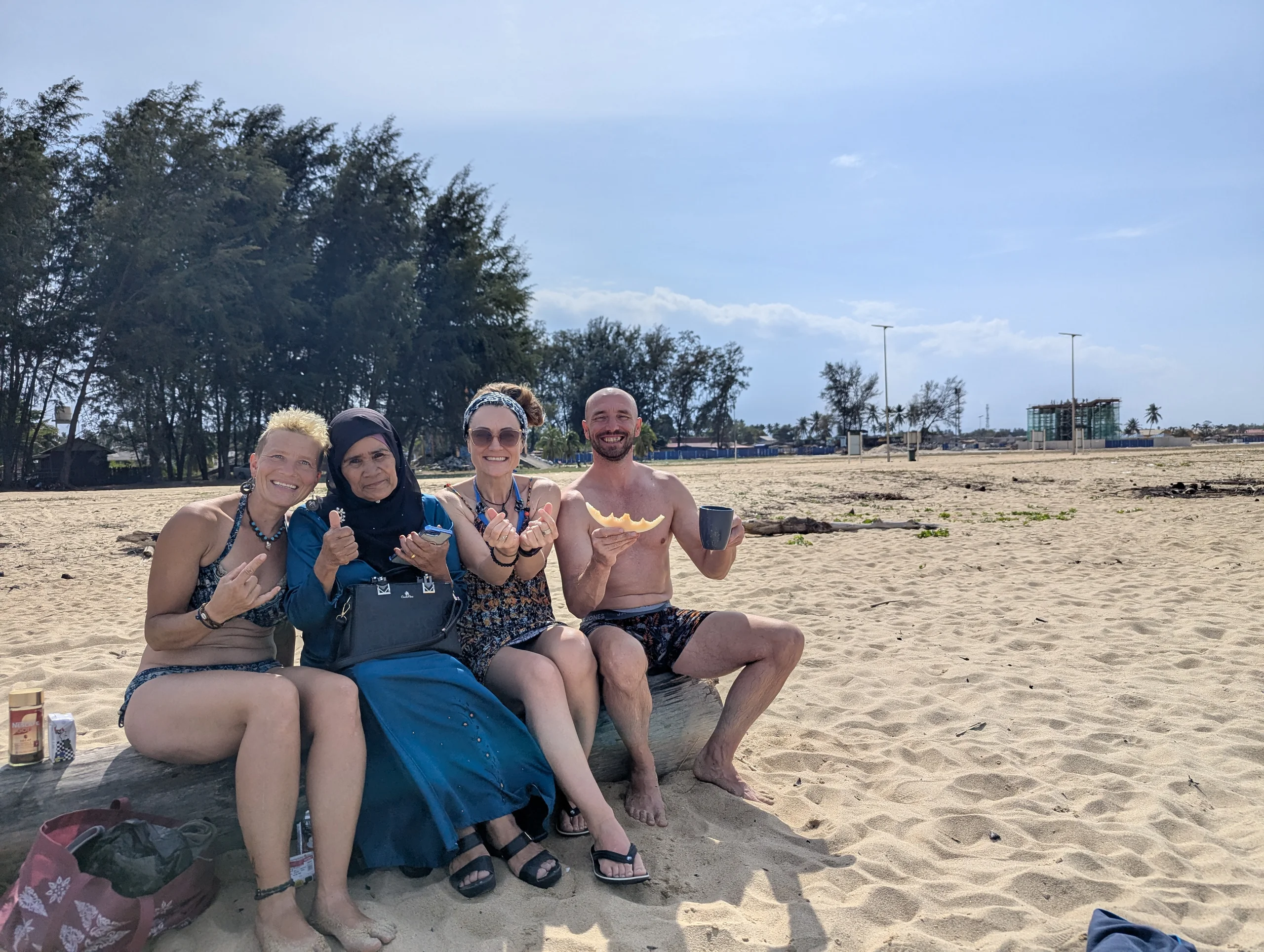 An elderly lady came by and was very motivated to take a lot of photos with us. She was very cute and it was interesting that she was so happy to take photos with tourists in bikinis. Most Malaysian women wear full body suites when they go for a swim.