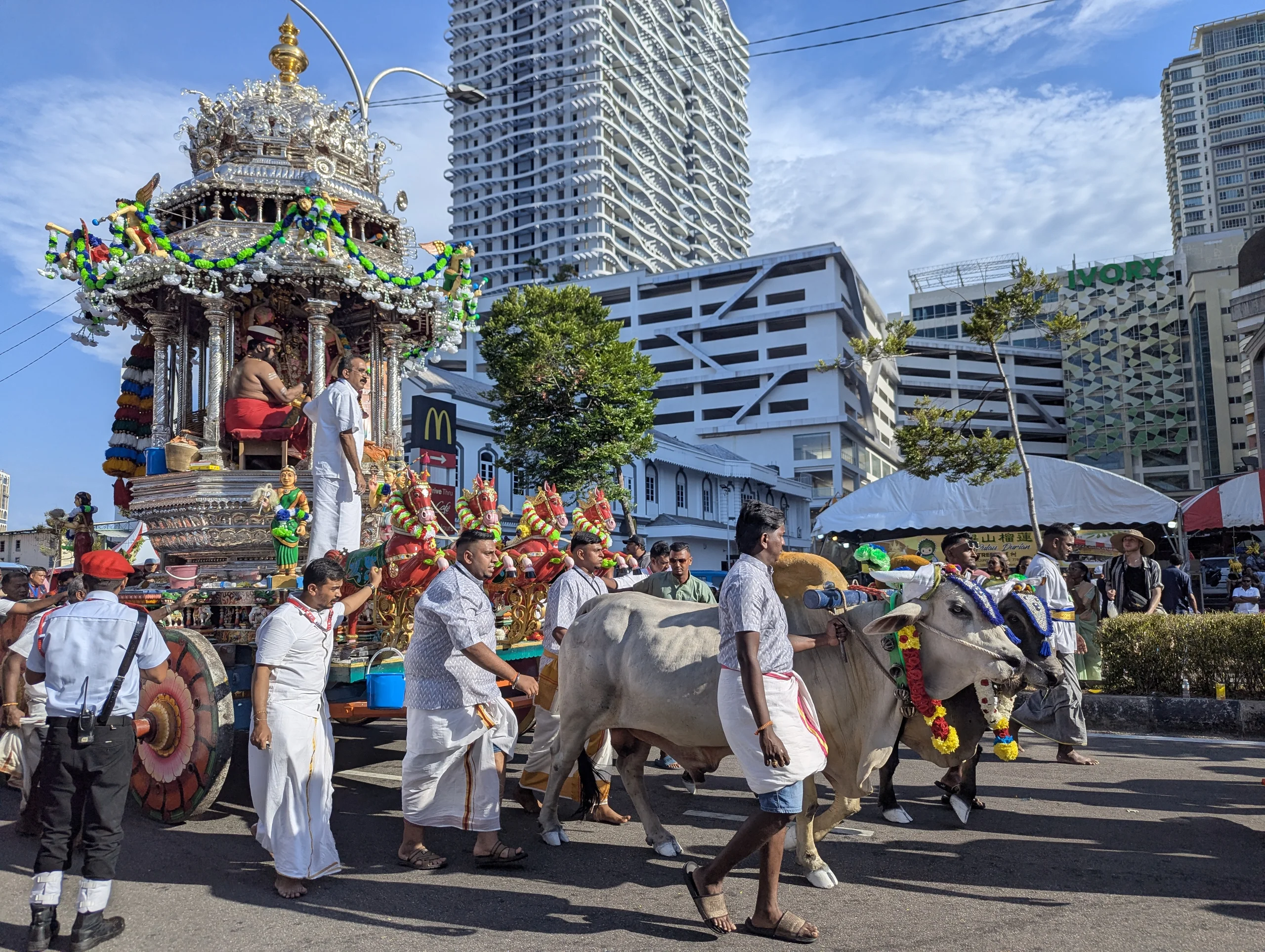 After the temple, we joint the Thaipusam festival. It is one of the major Tamil Hindu festivals with one two one and a half million visitors and it was crazy, colorful, and interesting. The main things going on are two wagons going through the city. One silver and one golden one.