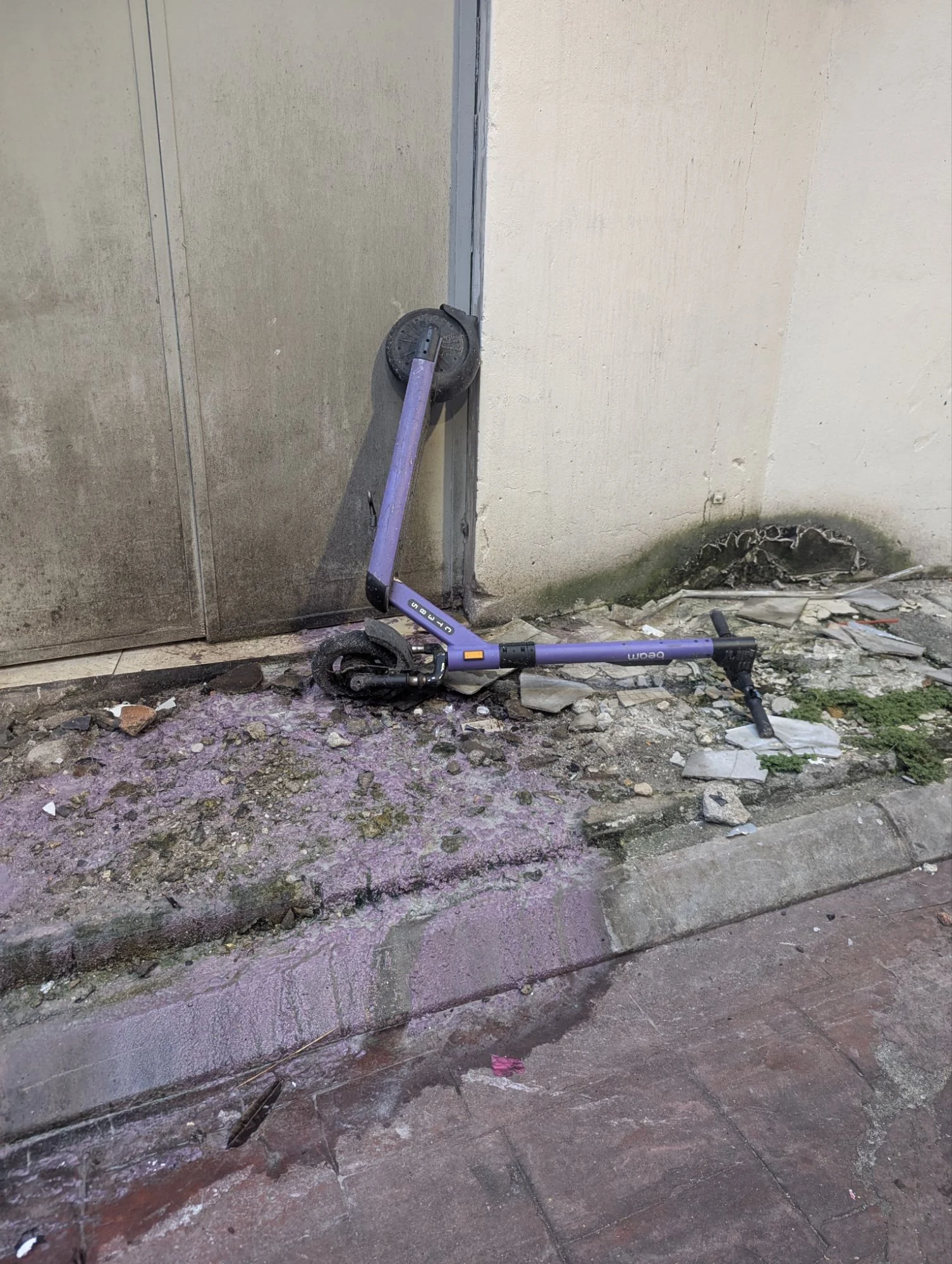 A scooter peeing while doing a handstand.